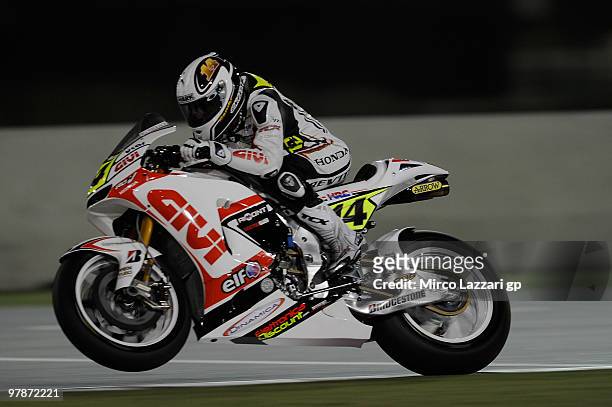 Randy De Puniet of France and LCR Honda MotoGP lifts the front wheel during the third day of testing at Losail Circuit on March 19, 2010 in Doha,...