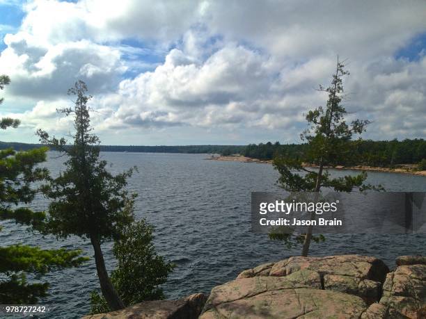 clouds over georgian bay, parry sound, ontario, canada - parry sound stock pictures, royalty-free photos & images