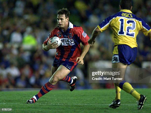 Josh Perry of the Knights tries to avoid Ian Hindmarsh of The Eels in the round 4 NRL match between the Newcastle Knights and the Parramatta Eels...