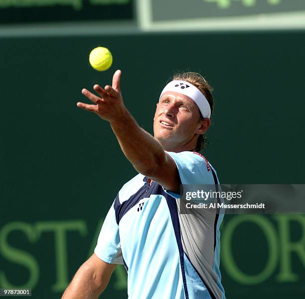 David Nalbandian serves to Ivan Ljubicic in the men's semifinals of the 2006 NASDAQ-100 Open at Crandoon Park Tennis Center in Key Biscayne, Florida,...