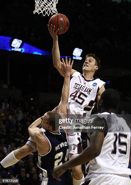 Nathan Walkup of the Texas A&M Aggies shoots over Tyler Newbold of the Utah St. Aggies during the first round of the 2010 NCAA men's basketball...