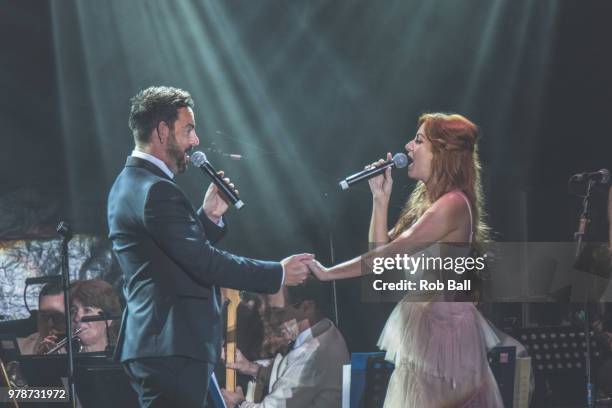 Ben Forster and Celia Graham perform during Andrew Lloyd Webber - A Musical Celebration, as part of his 70th Birthday celebration at The Royal...