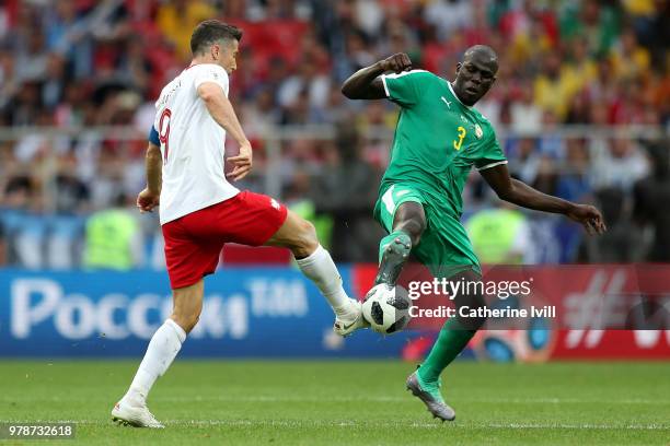 Artur Jedrzejczyk of Poland is tackled by Kalidou Koulibaly of Senegal during the 2018 FIFA World Cup Russia group H match between Poland and Senegal...