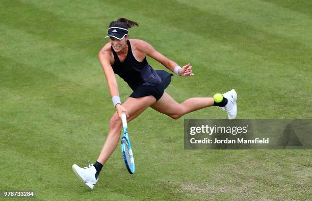 Garbine Muguruza of Spain reaches for a forehand during her first round match against Anastasia Pavlyuchenkova of Russia on Day Four of the Nature...