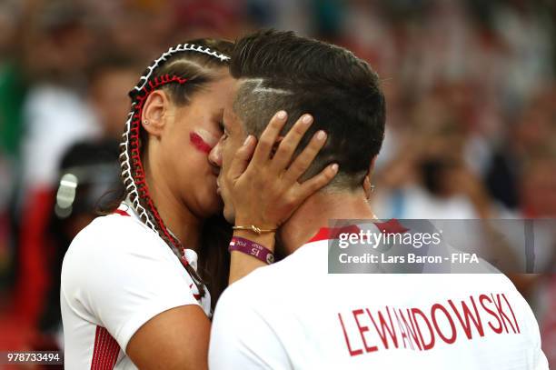 Robert Lewandowski of Poland's girlfriend, Anna Stachurska consoles Robert Lewandowski following his sides defeat in the 2018 FIFA World Cup Russia...