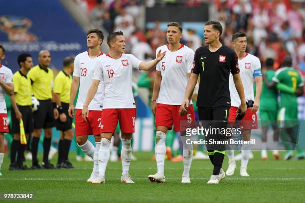Dawid Kownacki, Piotr Zielinski, Jan Bednarek, Wojciech Szczesny, and Robert Lewandowski of Poland look dejected following their sides defeat in the...