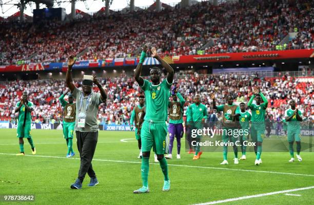 Cheikhou Kouyate of Senegal applauds fans after following his sides victory in the 2018 FIFA World Cup Russia group H match between Poland and...