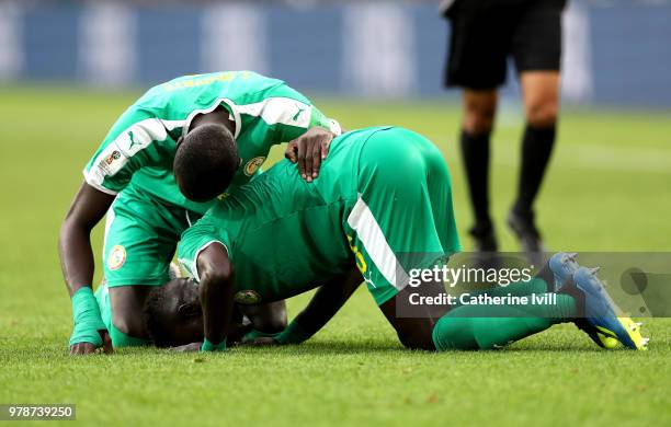 Idrissa Gana Gueye and Cheikhou Kouyate of Senegal celebrate victory following the 2018 FIFA World Cup Russia group H match between Poland and...