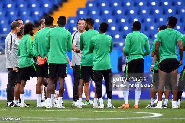 Saudi Arabia's coach Juan Antonio Pizzi speaks to his team players curing a training session at the Rostov Arena in Rostov-On-Don on June 19 on the...