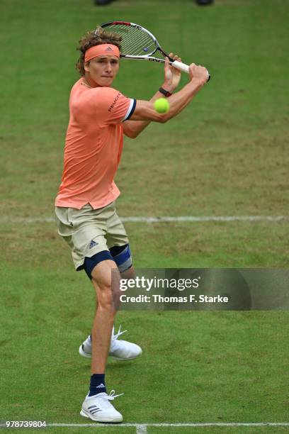 Alexander Zverev of Germany plays a backhand in his match against Borna Coric of Croatia during day two of the Gerry Weber Open at Gerry Weber...