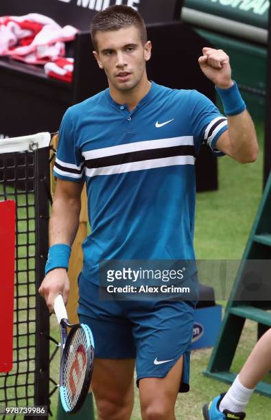 Borna Coric of Croatia celebrates after defeating Alexander Zverev of Germany during their first round match on day 2 of the Gerry Weber Open at...