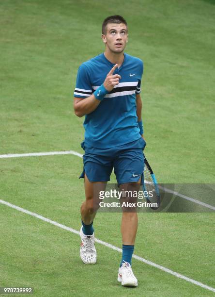 Borna Coric of Croatia celebrates after defeating Alexander Zverev of Germany during their first round match on day 2 of the Gerry Weber Open at...