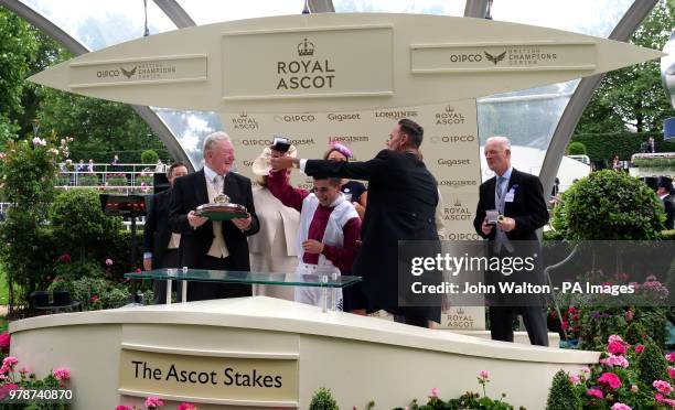 Jockey Andrea Atzeni and trainer Willie Mullins are presented with the trophies by Craig Revel Horwood after winning the Ascot Stakes with...