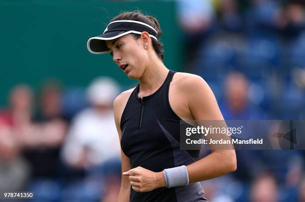 Garbine Muguruza of Spain celebrates winning a point during her first round match against Anastasia Pavlyuchenkova of Russia on Day Four of the...