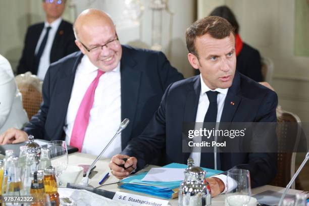 German Economy Minister Peter Altmaier and French President Emmanuel Macron attend the 20th German-Franco Ministerial Council at Schloss Meseberg on...