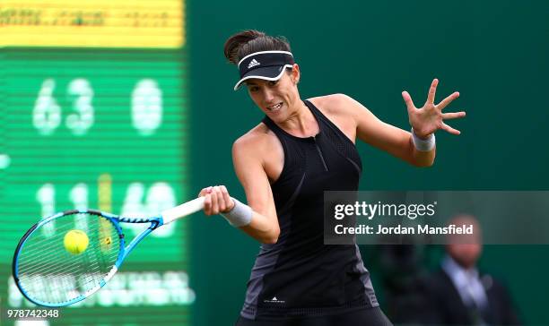 Garbine Muguruza of Spain plays a forehand during her first round match against Anastasia Pavlyuchenkova of Russia on Day Four of the Nature Valley...