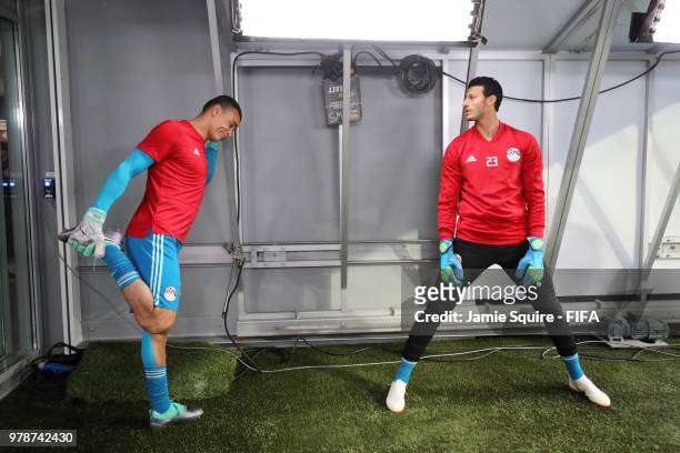 Essam El Hadary and Mohamed Elshenawy of Egypt stretch in the tunnel before the warm up prior to the 2018 FIFA World Cup Russia group A match between...