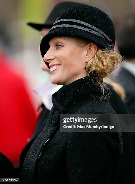 Zara Phillips pulls a face whilst watching the Cheltenham Gold Cup contenders parade prior to the race on day 4 of the Cheltenham Horse Racing...