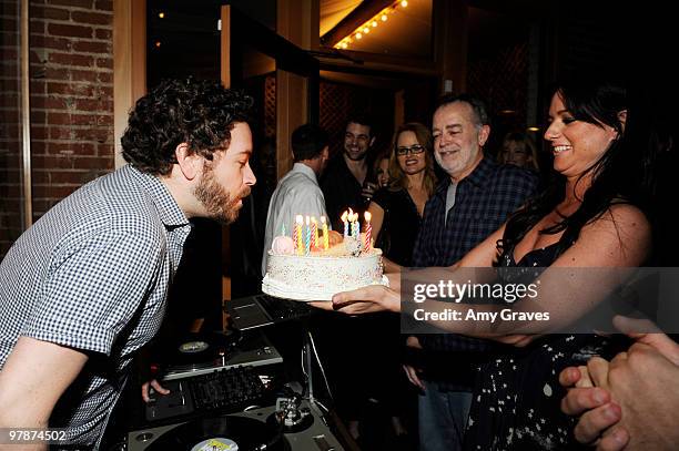 Danny Masterson blows out candles on his birthday cake the Shipley & Halmos event at Confederacy on March 18, 2010 in Los Angeles, California.