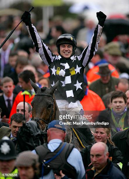Cheltenham Gold Cup winning Jockey Paddy Brennan rides winning horse Imperial Commander into the winners enclosure following the Cheltenham Gold Cup...