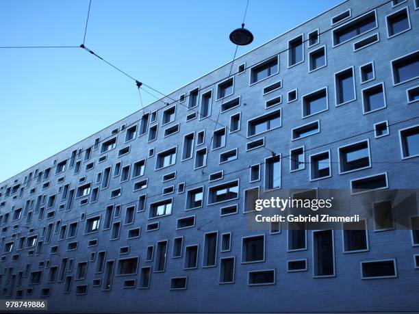 modern building with asymmetrical windows, basel, switzerland - basel switzerland stockfoto's en -beelden