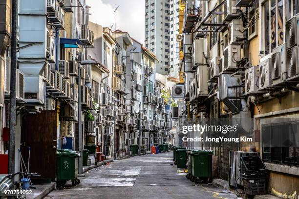 cooling fans alley - singapore alley stock pictures, royalty-free photos & images