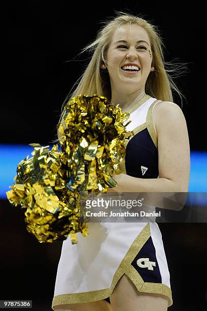 Georgia Tech Yellow Jackets cheerleader smiles during a break in the game against the first half against the Oklahoma State Cowboys during the first...