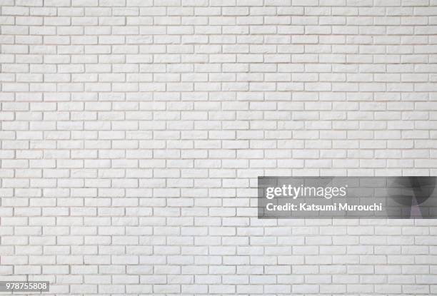 white brick wall texture background - bricks fotografías e imágenes de stock