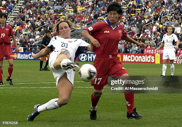 United States forward Abby Wambach battles for the ball with Korea DPR Hye Yong Jon Sunday, September 28, 2003 at Columbus Crew Stadium, Columbus,...