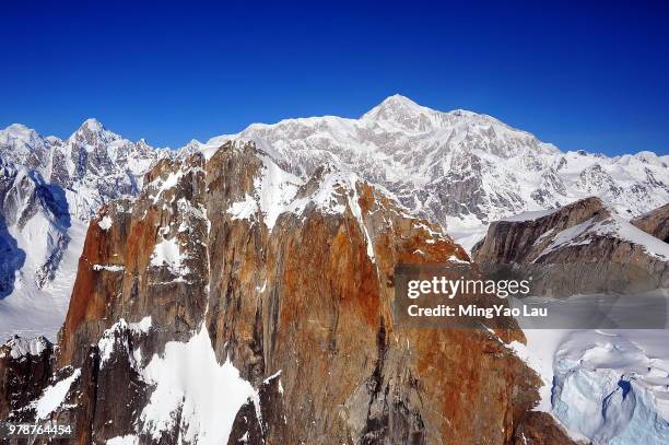 snow-capped mountain range under clear blue sky, talkeetna, alaska, usa - talkeetna stock pictures, royalty-free photos & images