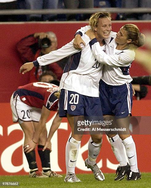 United States forward Mia Hamm celebrates with a hug from forward Abby Wambach October 1, 2003 at Gillette Stadium, Foxboro, Massachuttes, during the...