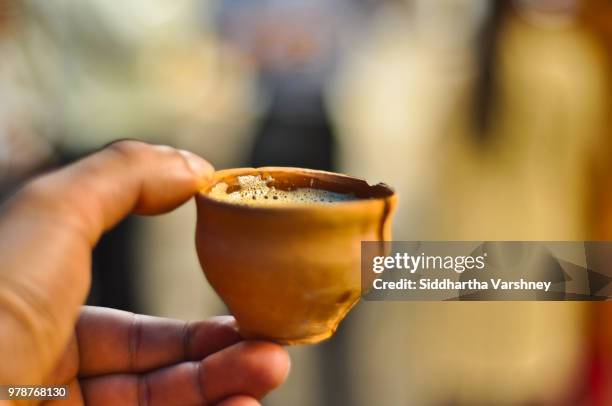 chai, in a kulhad, anyone? - chai tea stock pictures, royalty-free photos & images