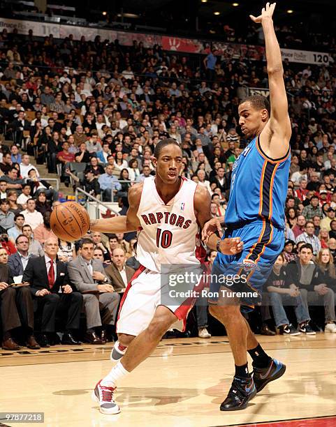 DeMar DeRozan of the Toronto Raptors drives against Thabo Sefolosha of the Oklahoma City Thunder during a game on March 19, 2010 at the Air Canada...