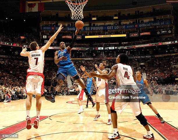 Jeff Green of the Oklahoma City Thunder attempts the layup over Andrea Bargnani and Chris Bosh of the Toronto Raptors during a game on March 19, 2010...