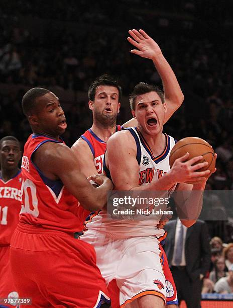 Danilo Gallinari of the New York Knicksis fouled by Jodie Meeks of the Philadelphia 76ers at Madison Square Garden on March 19, 2010 in New York...