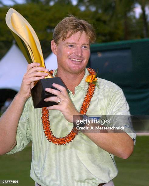 Ernie Els holds the winners trophy at Waialae Country Club Sunday, January 18, 2004 at the Sony Open in Hawaii. Els won the tournament after three...