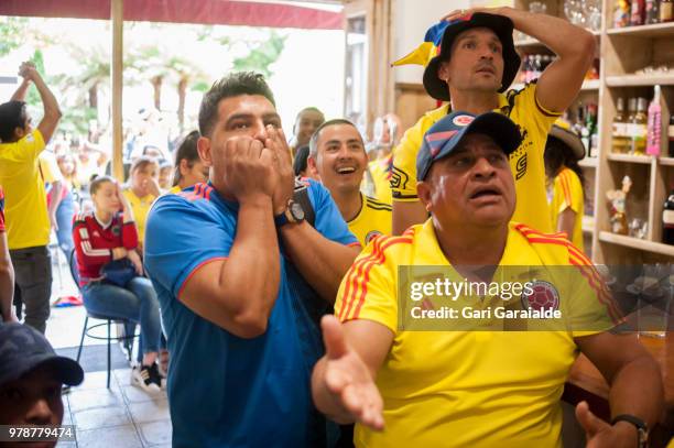 Colombian football fans watch their national team's Russia 2018 World Cup Group H match against Japan in a bar on June 19, 2018 in Irun, Spain.