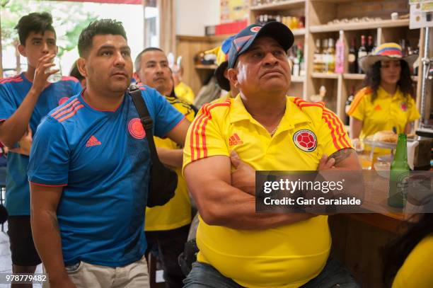 Colombian football fans watch their national team's Russia 2018 World Cup Group H match against Japan in a bar on June 19, 2018 in Irun, Spain.