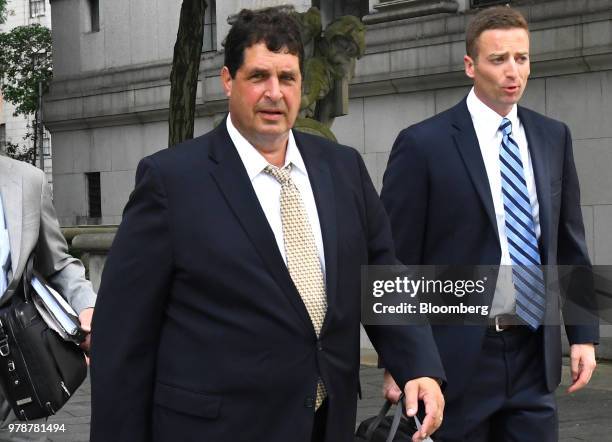 Steven Aiello, president of COR Development Co., left, arrives at federal court in New York, U.S., on Tuesday, June 19, 2018. State University of New...