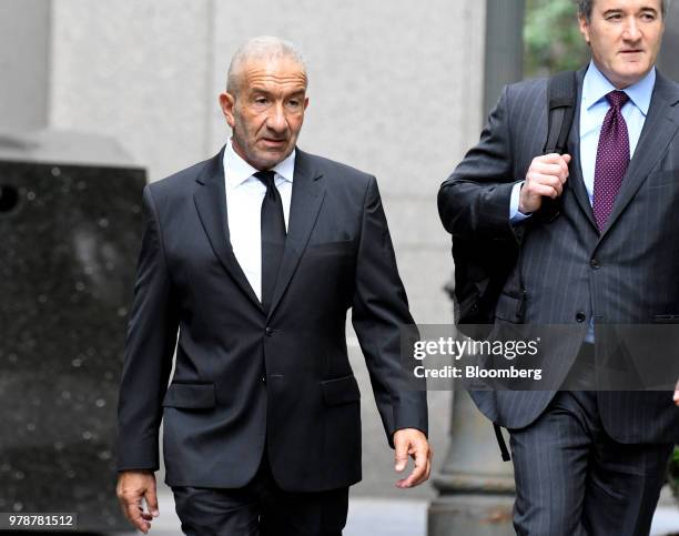 Alain Kaloyeros, former president of the State University of New York's Polytechnic Institute, left, arrives at federal court in New York, U.S., on...