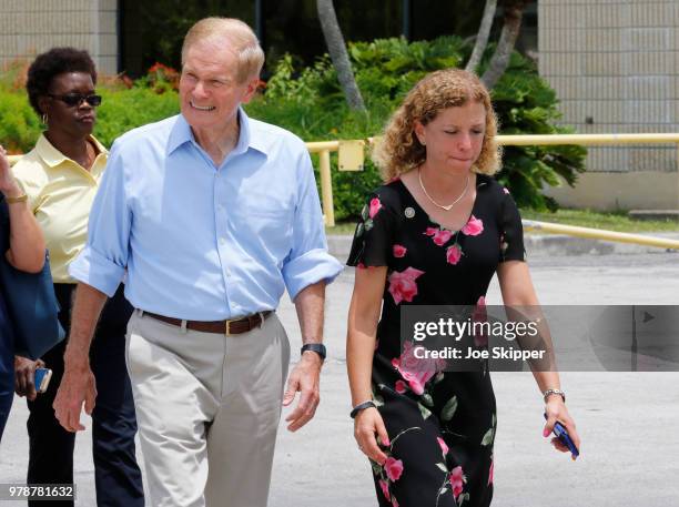 Sen. Bill Nelson , , and U.S. Rep. Debbie Wasserman Schultz , , walk to speak with the media after a security officer denied their access to the...