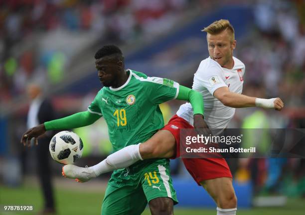 Mbaye Niang of Senegal is challenged by Jakub Blaszczykowski of Poland during the 2018 FIFA World Cup Russia group H match between Poland and Senegal...