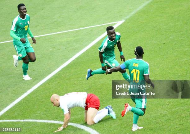 Idrissa Gueye between Ismaila Sarr and Sadio Mane of Senegal celebrate the first goal of Senegal during the 2018 FIFA World Cup Russia group H match...