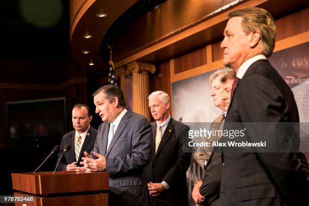 Sen. Ted Cruz speaks alongside Sen. Mike Lee , Sen. Ron Johnson , Sen. John Kennedy , Sen. Mike Rounds , Sen. David Purdue , at the U.S. Capitol at a...