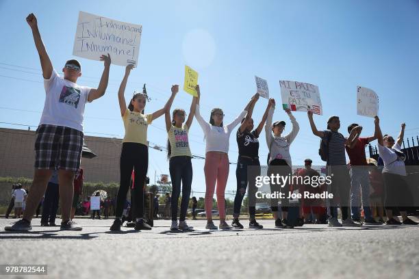 People protest the separation of children from their parents in front of the El Paso Processing Center, an immigration detention facility, at the...