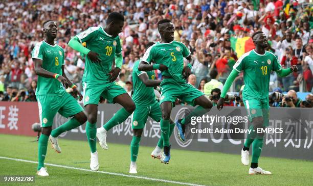 Senegal's M'Baye Niang celebrates scoring his side's second goal of the game with team-mates Idrissa Gueye , Ismaila Sarr and Salif Sane Poland v...