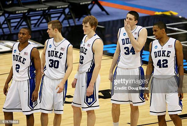 Nolan Smith, Jon Scheyer, Kyle Singler, Ryan Kelly and Lance Thomas of the Duke Blue Devils wait for play to begin after a timeout against the...