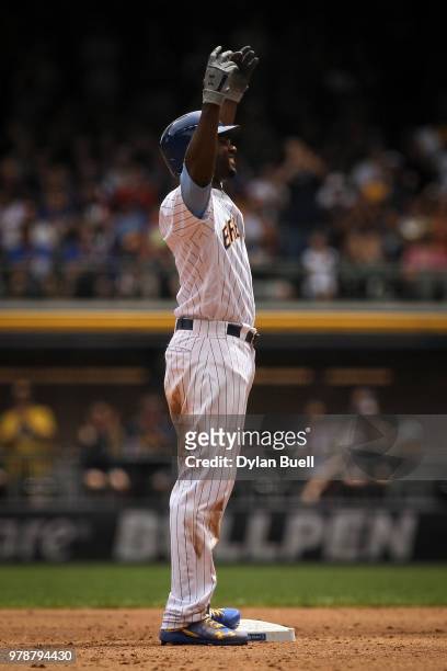 Lorenzo Cain of the Milwaukee Brewers celebrates after hitting a double in the third inning against the Philadelphia Phillies at Miller Park on June...