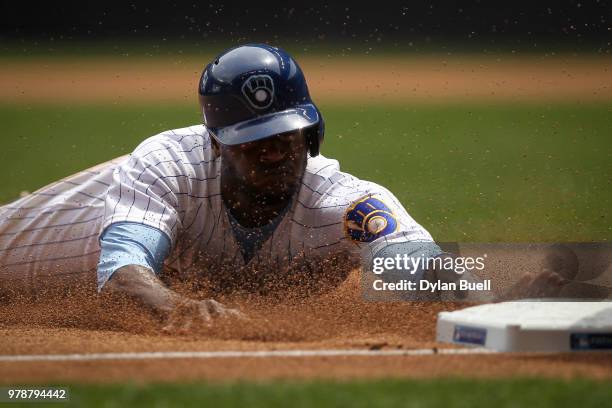 Lorenzo Cain of the Milwaukee Brewers steals third base in the third inning against the Philadelphia Phillies at Miller Park on June 17, 2018 in...