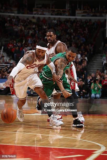 Mo Williams of the Cleveland Cavaliers and Acie Law of the Chicago Bulls chase after a loose ball on March 19, 2010 at the United Center in Chicago,...